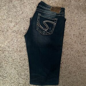 Silver Jeans Low Rise Distressed Twisted Flare